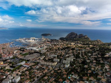 Panoramic aerial view on historical coastal Provencal city La Ciotat with old big shipyard summer vacation in Provence, France