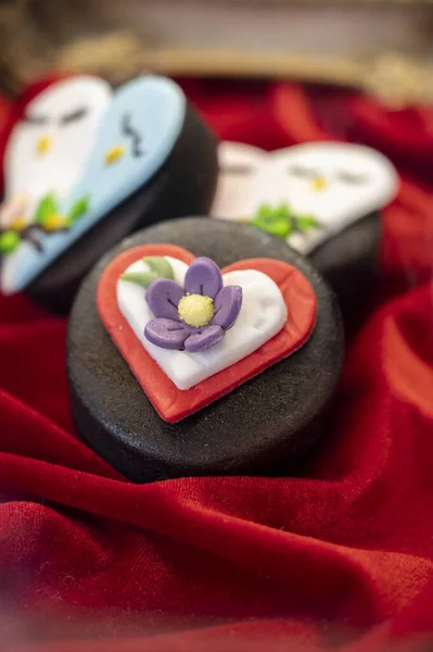 Food styling in bakery, wedding or happy valentine colorful cakes and candies decorated with chocolate hearts and flowers