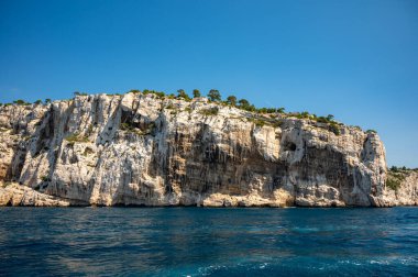 Limestone cliffs and blue sea near Cassis, boat excursion to Calanques national park in Provence, France