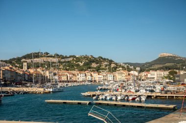 Sunny day in april in South of France, view on old fisherman's port with boats and colorful buildings in Cassis, Provence, France