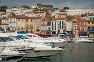 Rainy day in april in South of France, view on old fisherman's port with boats and colorful buildings in Cassis, Provence, France