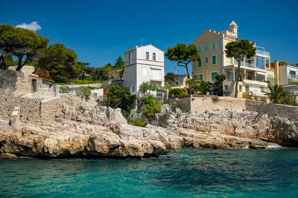 Sunny day in South of France, walking in ancient Provencal coastal town Cassis, narrow streets and colorful buildings, Provence, France in spring