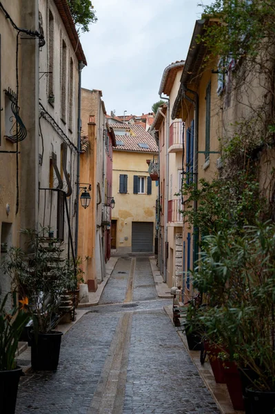 Rainy day in April in South of France, narrow streets and colorful buildings in Cassis, Provence, France