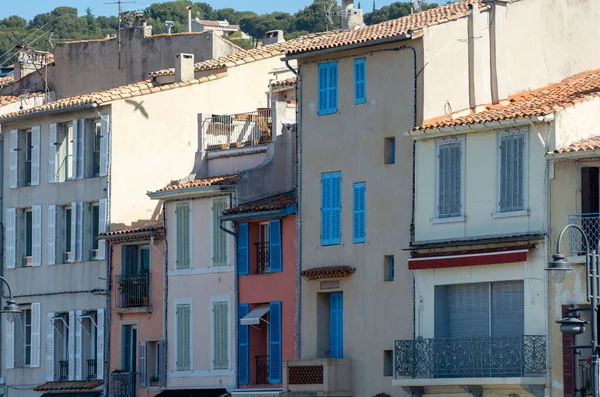 Sunny day in South of France, walking in ancient Provencal coastal town Cassis, narrow streets and colorful buildings, Provence, France in spring