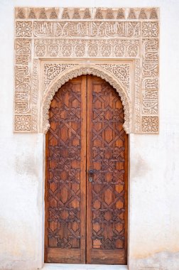 Example of medieval geometrical ornaments on old wooden doors in Granada, Andalusia, Spain