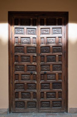 Example of medieval geometrical ornaments on old wooden doors in Granada, Andalusia, Spain