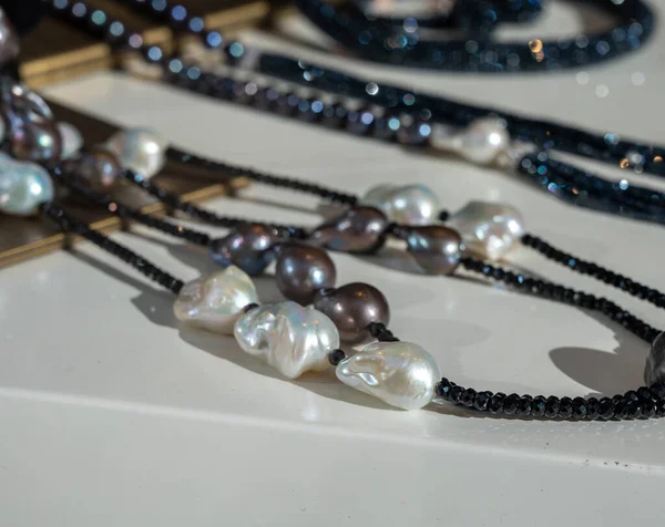 Natural grey and white river pearls necklace collier and another fine jewelry in sunlights