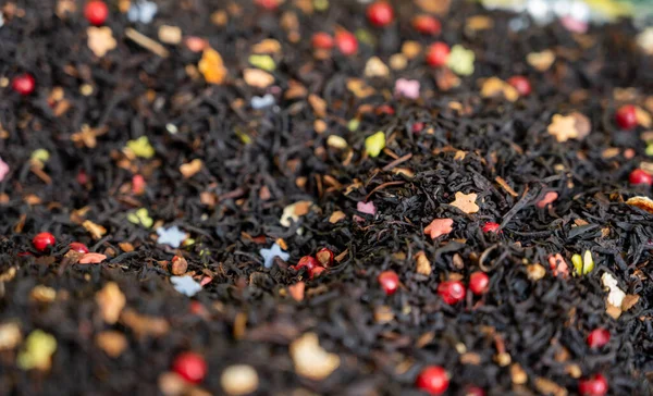 Blended black leaf dry tea with aromatic flowers, spices in tea shop in Granada, Andalusia, Spain