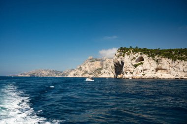 Limestone cliffs and blue sea near Cassis, boat excursion to Calanques national park in Provence, France