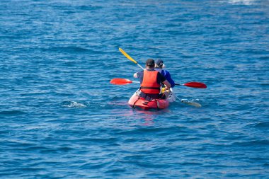 Unidentified two sporters in kayak is Calanque de Port-Miou near Cassis, excursion to Calanques national park in Provence, France