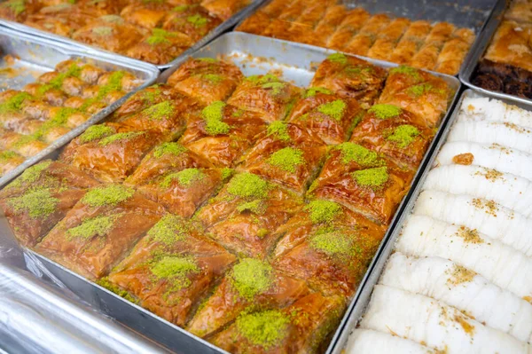 Turkish or arabic sweet dessert, made from filo pastry, filled with chopped nuts and sweetened with syrup or honey, close up