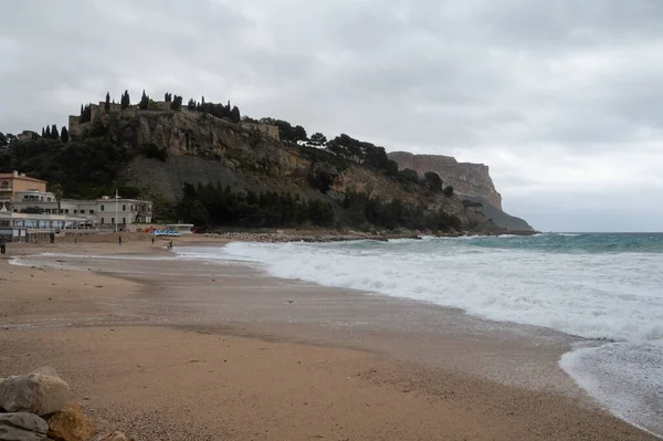 Storm on sea, high waves on yellow sandy beach in Cassis, Provence, France