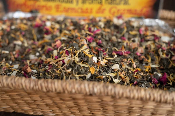 Blended black leaf dry tea with aromatic flowers, spices in tea shop in Granada, Andalusia, Spain