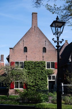 Walking in historical Dutch fisherman's village in North-Holland, Enkhuizen, Netherlands in spring