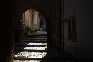 Walking in historical town Gaeta, summer vacation destination on Tyrrhenien sea with sandy beaches and old houses, Italy