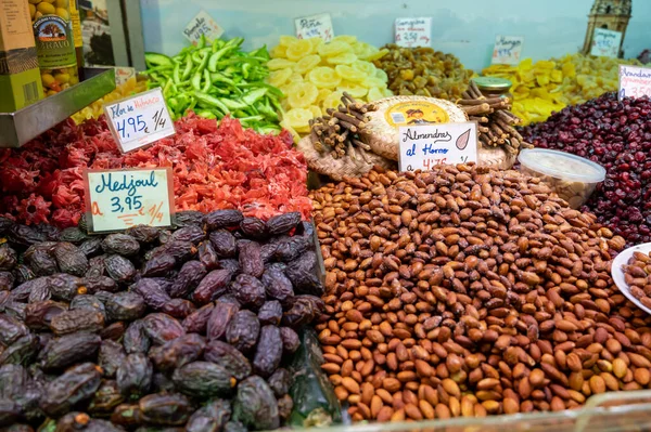 Mixed sweet colorful dried exotic fruits and nuts on Spanish farmers market, Malaga, Spain
