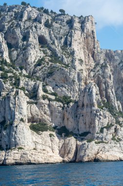 Limestone cliffs and blue sea near Cassis, boat excursion to Calanques national park in Provence, France