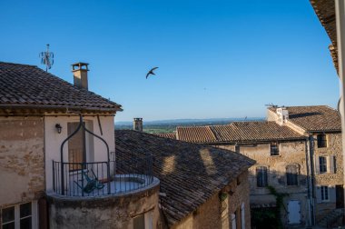 VIew on medieval buildings in sunny day, vacation destination, famous wine making village Chateauneuf-du-pape in Provence, France