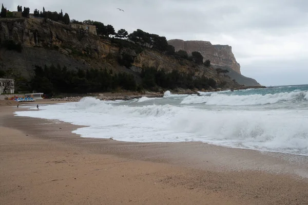 Storm on sea, high waves on yellow sandy beach in Cassis, Provence, France