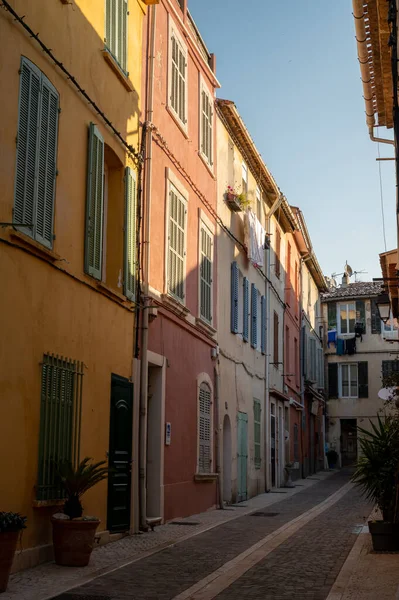 Sunny day in South of France, walking in ancient Provencal coastal town Cassis, narrow streets and colorful buildings, Provence, France in spring