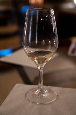 White wine tasting in underground cellars caves of French wine domain in Puligny-Motrachet village, Burgundy, France
