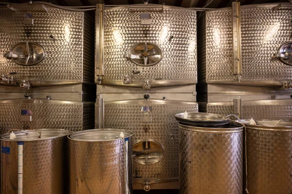 Stages of wine production from fermentation to bottling, visit to wine cellars in Cote d\'Or, Burgundy, France, steel vats for fermentation.