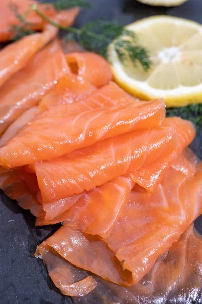 Slices Tasty Smoked Scottish Salmon Fish Served Black Plate Lemon — 스톡 사진