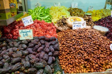 Mixed sweet colorful dried exotic fruits and nuts on Spanish farmers market, Malaga, Spain