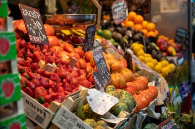 Colorful fresh ripe fruits and vegetables on farmers market in Malaga, Spain