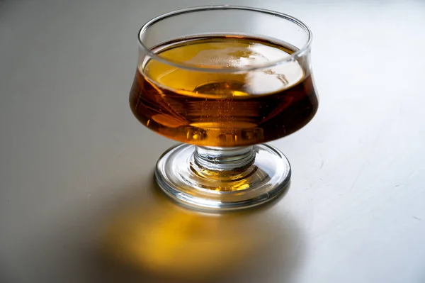 One glass of apple cider drink on white table, Normandy, France