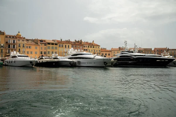 Colorful houses and yachts in Port of Saint Tropez, village on Mediterranean sea with yacht harbour, Provence, summer vacation in France