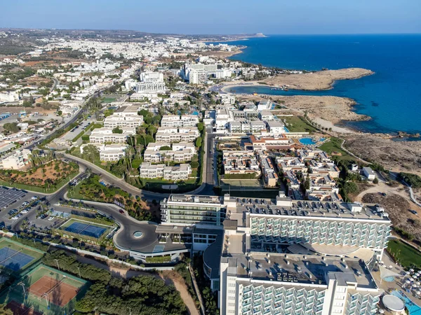 Aerial panoramic view on holidays villas and resorts and blue crystal clear water on Mediterranean sea near Nissi beach, Ayia Napa, Cyprus. Sea holidays.