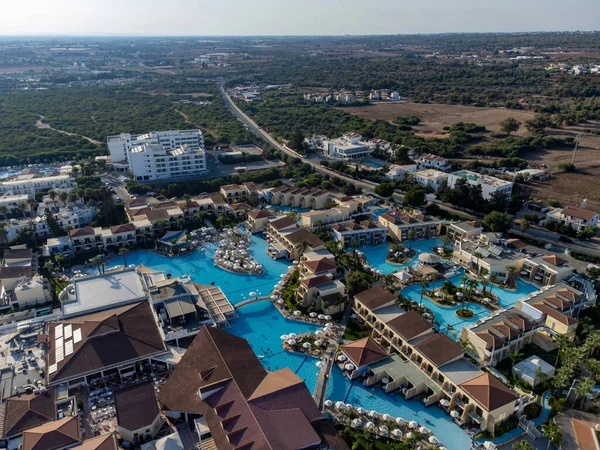 Aerial panoramic view on holidays villas and resorts and blue crystal clear water on Mediterranean sea near Nissi beach, Ayia Napa, Cyprus. Sea holidays.