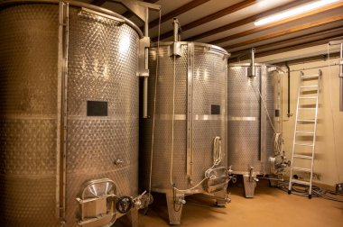 Stages of wine production from fermentation to bottling, visit to wine cellars in Cote d'Or, Burgundy, France, steel vats for fermentation.