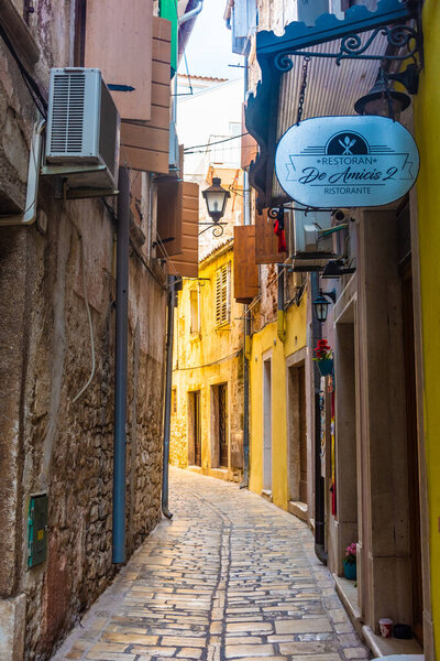 ROVINJ, CROATIA, 14 AUGUST 2019: Beautiful and colorful street in the old town