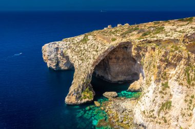 The Blue Grotto of Malta, rock formation on the sea with crystal clear water