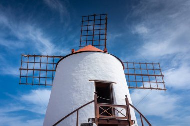 Beautiful white windmill among the cactus of Lanzarote, Canary Islands, Spain