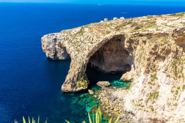The Blue Grotto of Malta, rock formation on the sea with crystal clear water