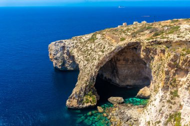 The Blue Grotto of Malta, rock formation on the sea with crystal clear water