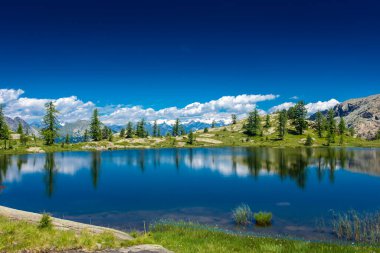 Reflection on the Mount Avic Lake in Aosta Valley, Italy