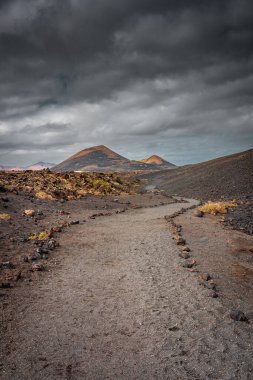 Wild volcanic landscape of Los Volcanes Natural Park in Lanzarote, Canary Islands, Spain
