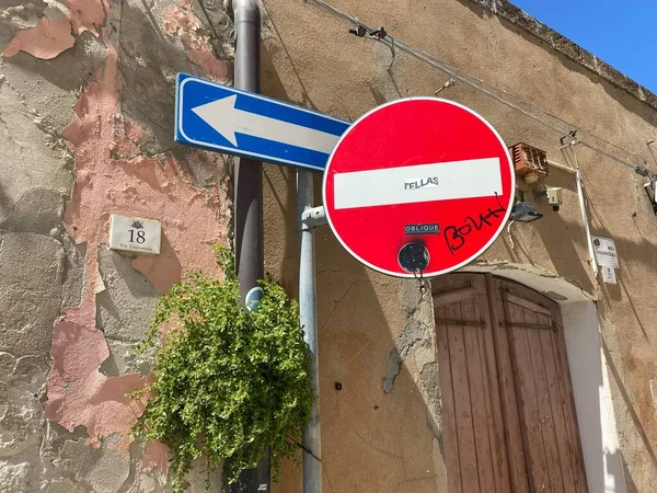 Street signs and symbols on the wall in the streets of the center of the old town in the Sardegna.