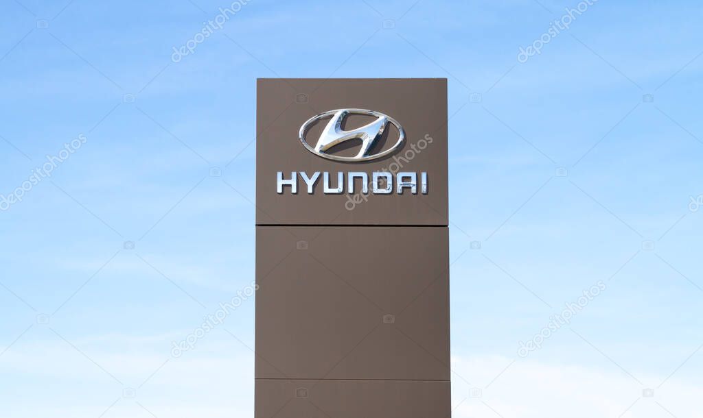 Krakow, Poland - March 27, 2022: Hyundai Motor Company logo. Korean car manufacturer sign. Dealership forecourt pylon signboard with corporation brand logotype.