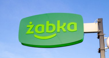 Krakow, Poland - March 27, 2022: Zabka shop signboard with brand logo sign. Chain of small convenience grocery stores in Poland.