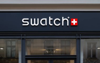 Krakow, Poland - May 2, 2022: Swatch store logo sign. Swiss watchmaker signboard with logotype above shop entrance.