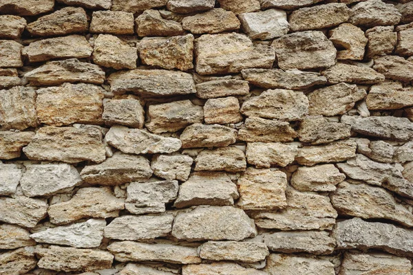 Yellow stone fence beautiful background.