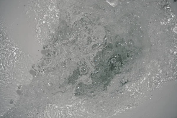 Toilet, Flushing Water, close up. Toilet in the process of washing it off.