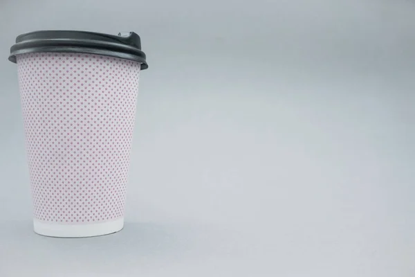 Paper cup for hot drinks, template. Paper cup and plastic lid mockup or mock up template. Copy space.