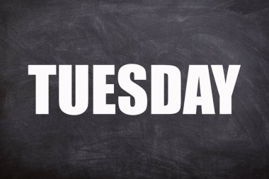 Tuesday text with blackboard background. And Tuesday is the second day of the week.
