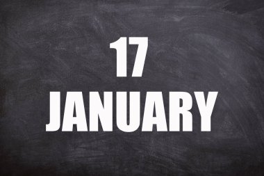 17 January text with blackboard background for calendar. And January is the first month of the year.